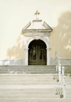 Old church doors at the to of the stairs