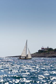 A small boat sailing on a sunny morning