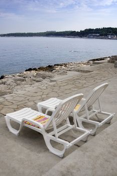 Two beach chairs near the sea