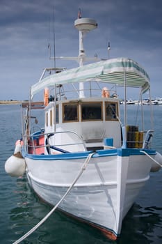 Old wooden fishing boat at the bay