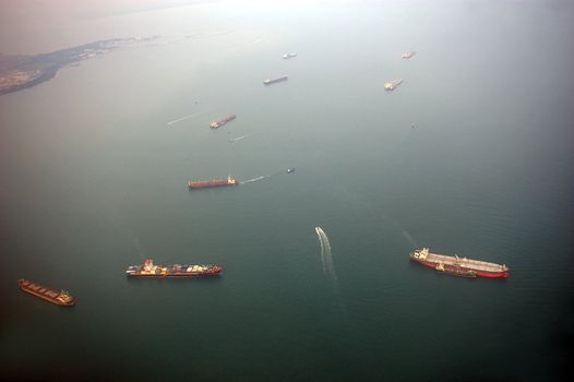 Cargo ships entering the port in Singapore, one of the busiest ports in the world.