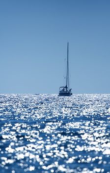 A small boat sailing on a sunny morning