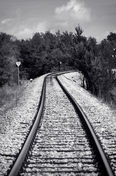 Black and white old style photo of a train railway