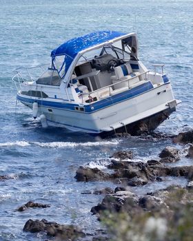 Motorboat crash on rocky shore