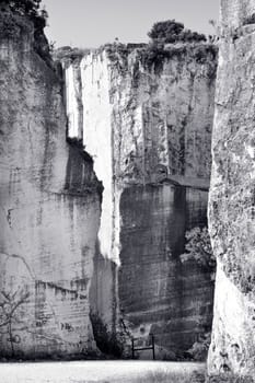 Old abandoned stone quarry - black and white toned photo