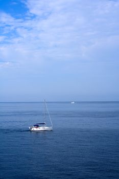 A small boat sailing on a sunny morning