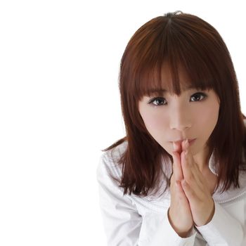 Attractive girl pray, closeup portrait of Asian business woman with copyspace on white.