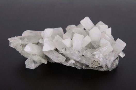 Druze quartz crystals on a gray background
