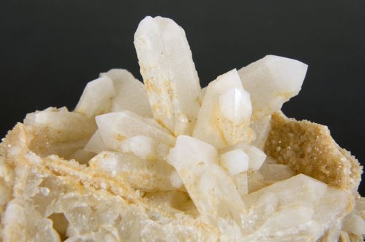 Druze quartz crystals on a gray background