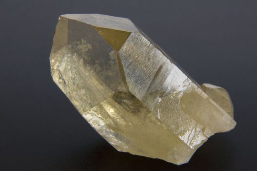 large quartz crystal on a gray background