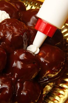 profiterole, classic italian dessert with chocolate 