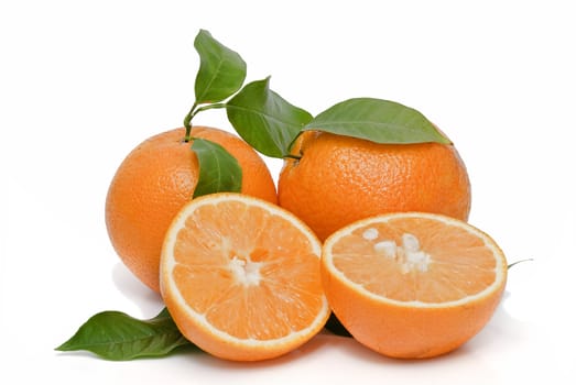 Spanish oranges from Valencia with leaves and its juice isolated on a white background.