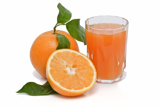 Spanish oranges from Valencia with leaves and its juice isolated on a white background.