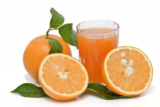 Spanish oranges from Valencia with leaves and its juice isolated on a white background.