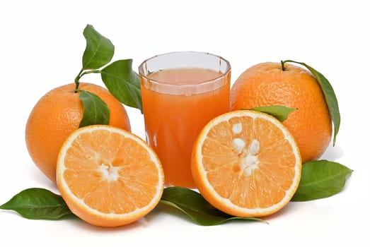 Spanish oranges from Valencia with leaves and its juice isolated on a white background.