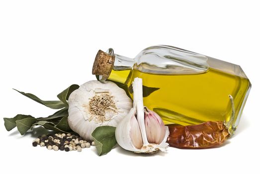 Mediterranean spices and olive oil isolated on a white background.