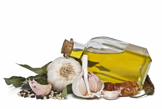 Mediterranean spices and olive oil isolated on a white background.