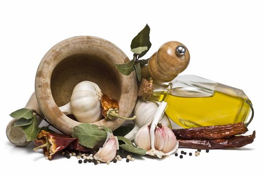 Mediterranean spices and olive oil isolated on a white background.