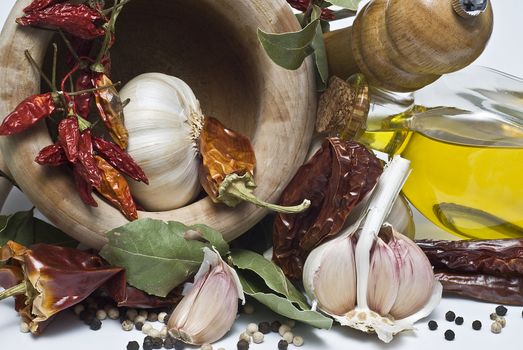 Mediterranean spices and olive oil isolated on a white background.