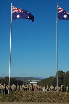 australian soldiers, australian flags, Canberra Parliament House in background,