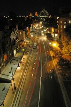 The Rocks, Harbour Bridge in background, light trails, night scene