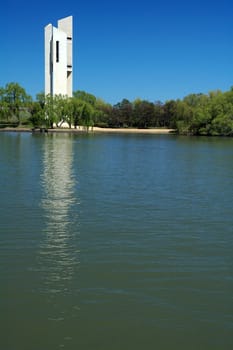 famous white Carillion in Canberra, lake with boat in foreground