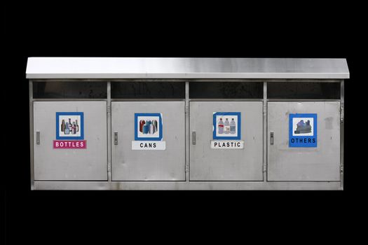 Recycle bins with four categories - many uses for save the environment concept, isolated in black background.