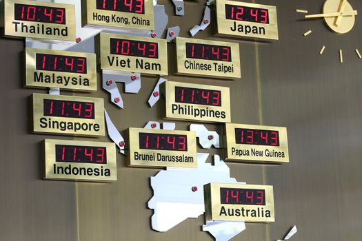 digital  clocks with different asian cities in a map