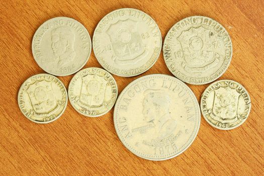 Antique Ferdinand Marcos coin on the wood background