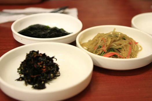 Bowls of Kimchi traditional Korean spicy vegetable noodles.