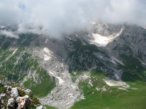 Mountains; rocks; a relief; a landscape; a hill; a panorama; Caucasus; top; a slope; a snow; a cool; clouds