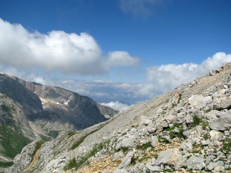 Mountains; rocks; a relief; a landscape; a hill; a panorama; Caucasus; top; a slope; a snow; a cool