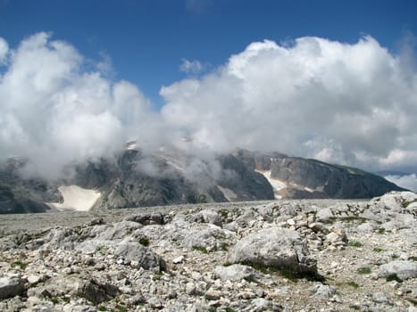 Mountains; rocks; a relief; a landscape; a hill; a panorama; Caucasus; top; a slope; a snow; a cool; clouds