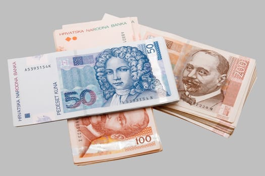 Croatian Kuna banknotes isolated on gray background