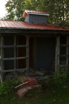 Old shack with red metal roof