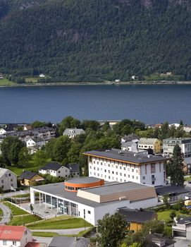 View over the small Norwegian town Aandalsnes, with the old hotel and new cultural house in the middle.