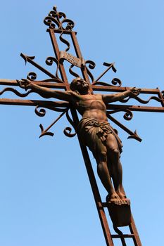 old religious metal cross in retro look