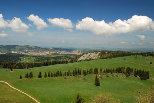 Jura hills and La-Chaux-de-Fonds city seen from Tete-de-Ran