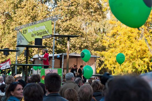 STUTTGART - Oct 09: 150K people protest against the S21 rail project in Stuttgart on Oct 09, 2010 in Stuttgart. S21 station is one of the most expensive and controversial railway projects with regular demonstrations going on. The photo shows the final event in the Schlosspark after a demonstration moving through the main streets of Stuttgart with at least 150.000 people.