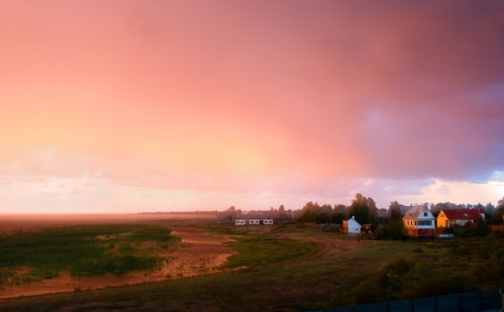 On a decline before a thunder-storm the sky has accepted fantastic crimson coloring.