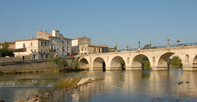 medieval bridge of sommieres, little town in gard, france