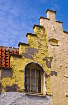 Fragment of a classical dwelling house in Bruges. Belgium. Summer urban landscape. Dutch culture.