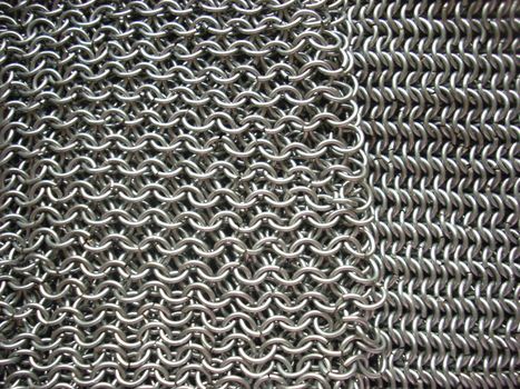 This is the texture of antique chain mail. Of course, it’s a hand-made article. 