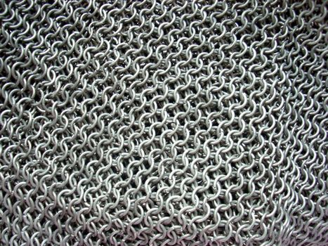 This is the texture of antique chain mail. Of course, it’s a hand-made article. 