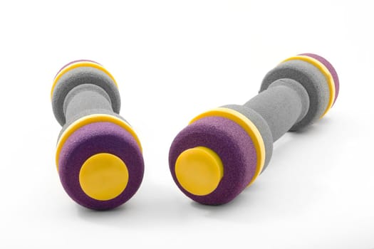 Two dumbbells on a white background