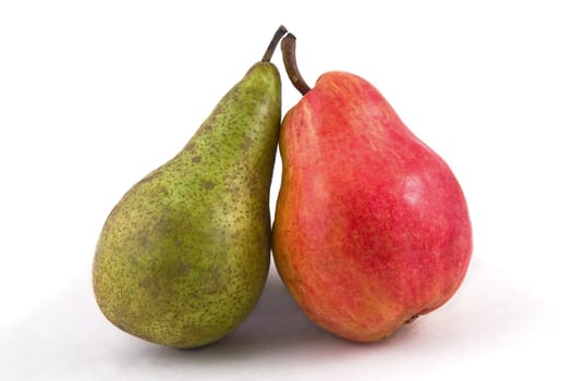 Ripe red and green pears on a white background