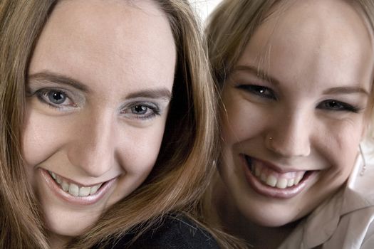 Studio portrait of two lesbian women laughing