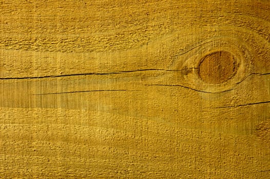 Close-up of a pine plank with a knot in it.