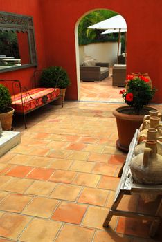 Courtyard of mediterranean villa in French Riviera. Shallow depths of filed, focus on amphoras.