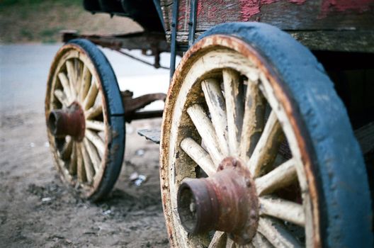 A set of wheels on an old stagecoach.